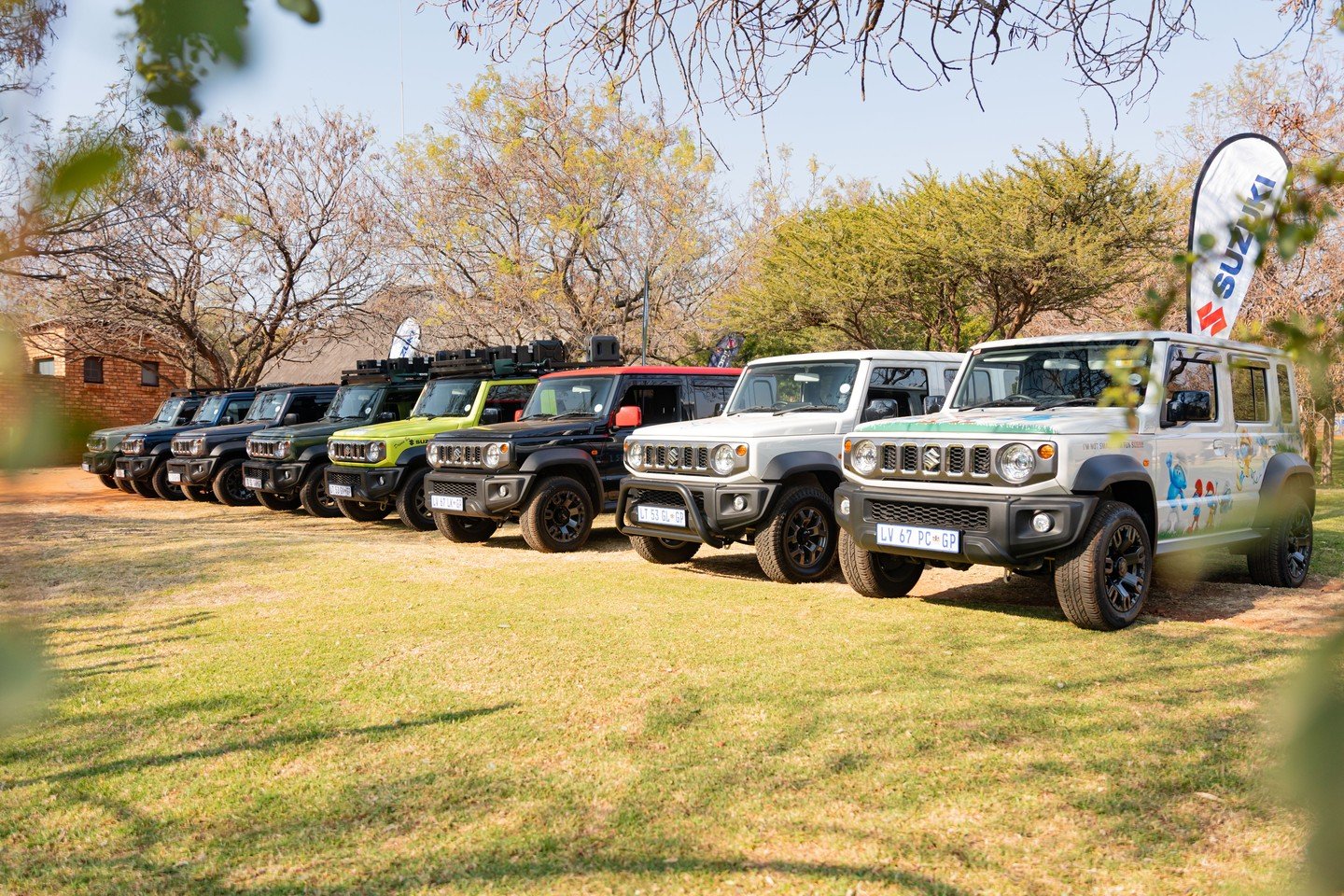 A row of jimny cars next to each other